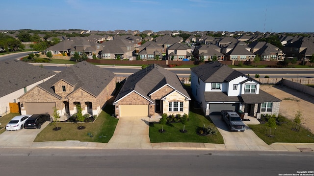 11206 Coppola, San Antonio, TX 78254 - view of front of property with concrete driveway, stone siding, and a residential view