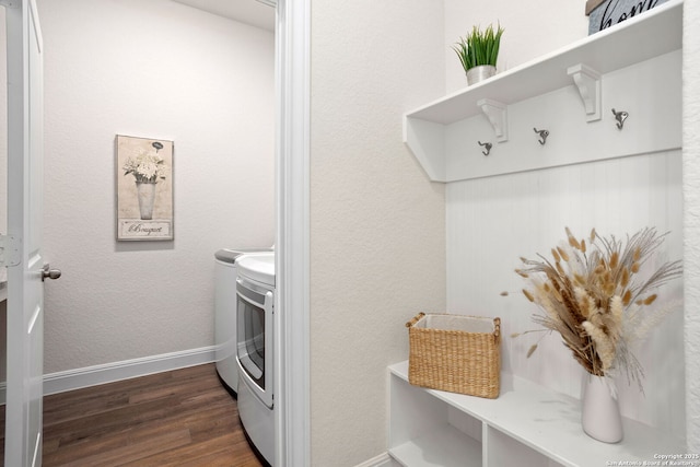 11206 Coppola, San Antonio, TX 78254 - washroom with washing machine and dryer, baseboards, dark wood-style floors, and laundry area