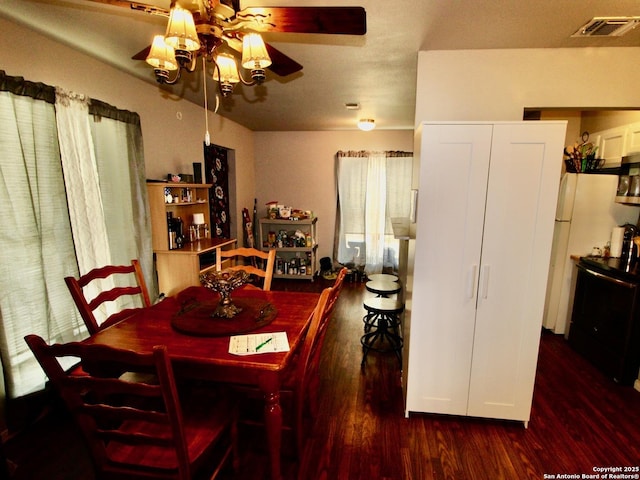 12365 Rudolph Rd, Atascosa, TX 78002 - dining space featuring wood finished floors, visible vents, and ceiling fan
