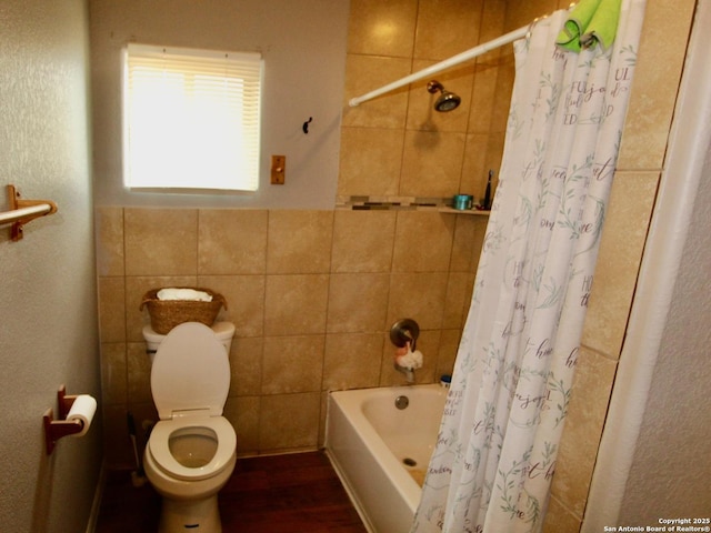 12365 Rudolph Rd, Atascosa, TX 78002 - full bath featuring shower / bath combo, toilet, wood finished floors, and tile walls