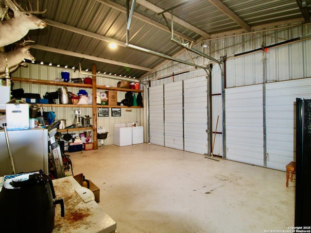 12365 Rudolph Rd, Atascosa, TX 78002 - garage featuring washer and clothes dryer and metal wall