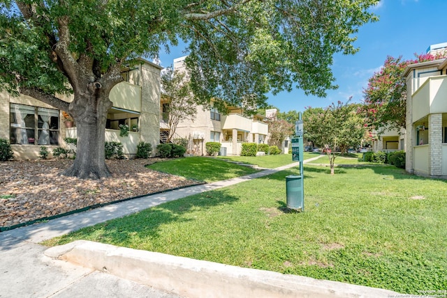 surrounding community with a yard