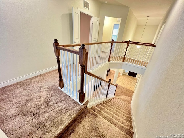 3727 Retreat Run, San Antonio, TX 78253 - stairway featuring baseboards, a textured wall, visible vents, and carpet