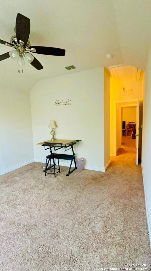 3727 Retreat Run, San Antonio, TX 78253 - carpeted spare room with lofted ceiling, attic access, visible vents, and ceiling fan