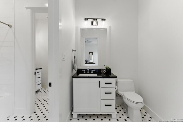 full bathroom featuring tile patterned floors, toilet, vanity, baseboards, and walk in shower