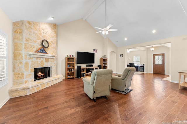 108 County Road 4325, Hondo, TX 78861 - living room with a fireplace, wood finished floors, a wealth of natural light, and a ceiling fan