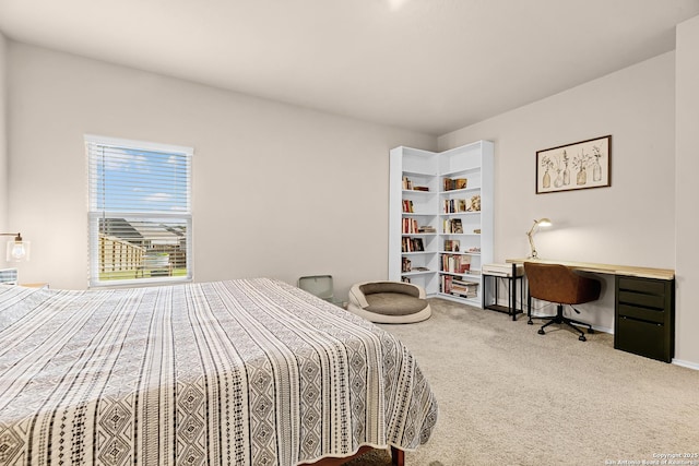 carpeted bedroom with baseboards