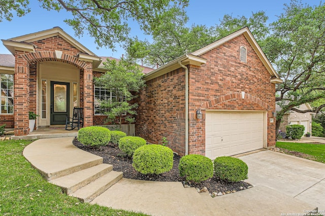 ranch-style house featuring driveway, brick siding, and a garage