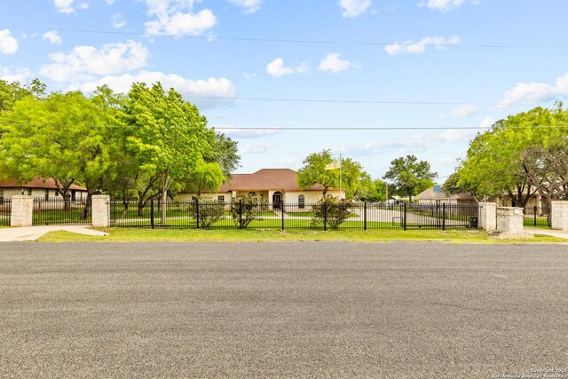 12037 Poinciana, San Antonio, TX 78245 - view of front of property with stucco siding, a gate, and a fenced front yard