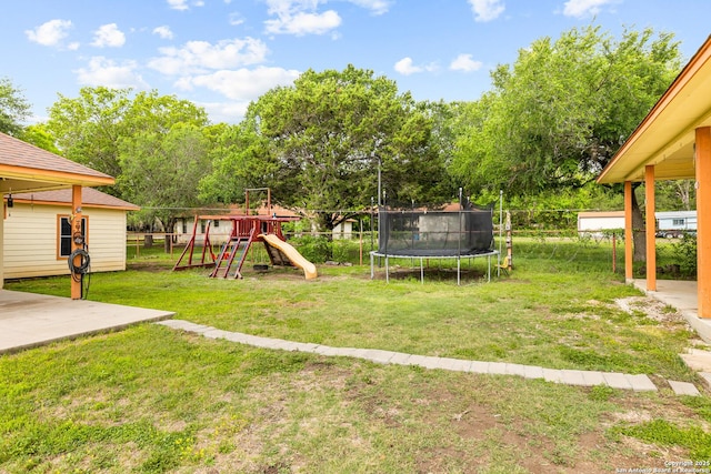 12037 Poinciana, San Antonio, TX 78245 - view of yard with a fenced backyard, a playground, and a trampoline