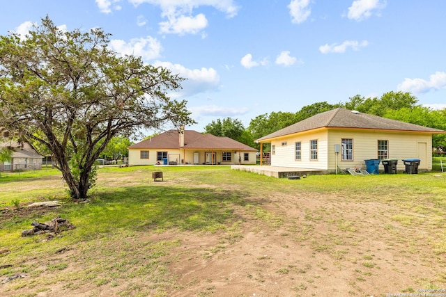 12037 Poinciana, San Antonio, TX 78245 - back of property featuring a yard