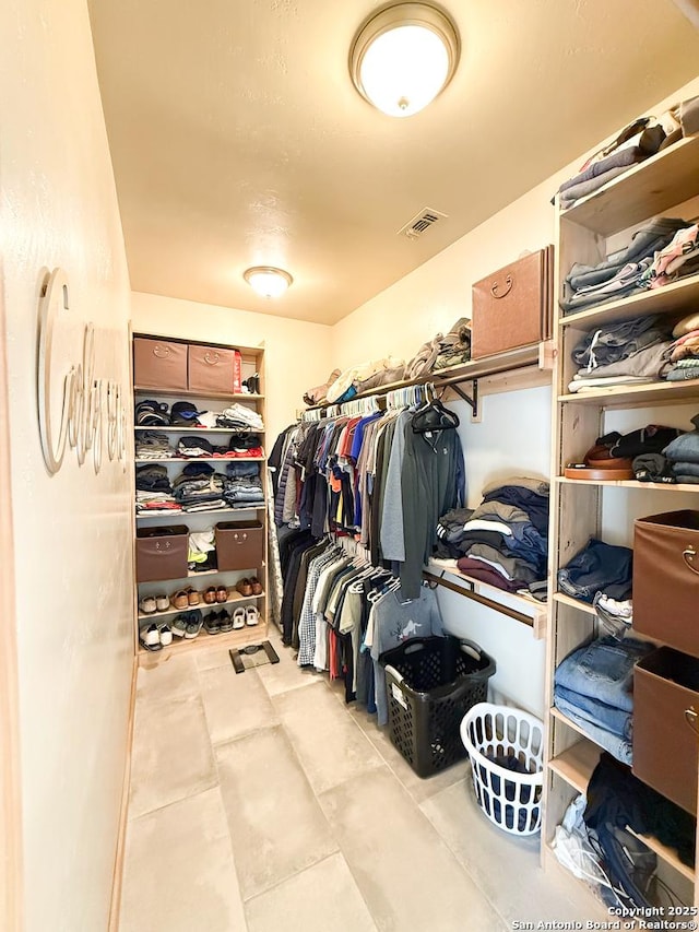 spacious closet featuring tile patterned floors and visible vents