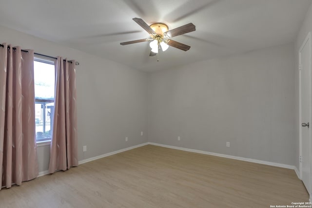 1051 Country Clb Unit 20, Seguin, TX 78155 - unfurnished room featuring light wood-style floors, a ceiling fan, and baseboards