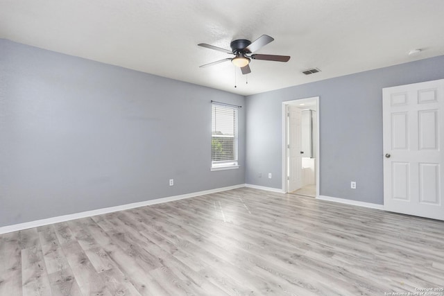 unfurnished bedroom with baseboards, visible vents, light wood-style floors, a ceiling fan, and connected bathroom
