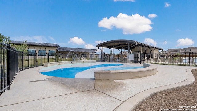 pool with fence and a patio area