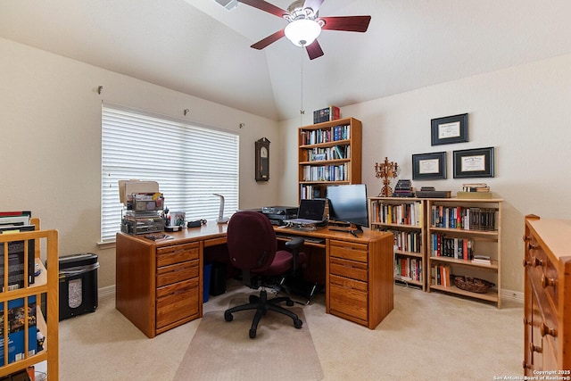 office area with baseboards, vaulted ceiling, light colored carpet, and ceiling fan