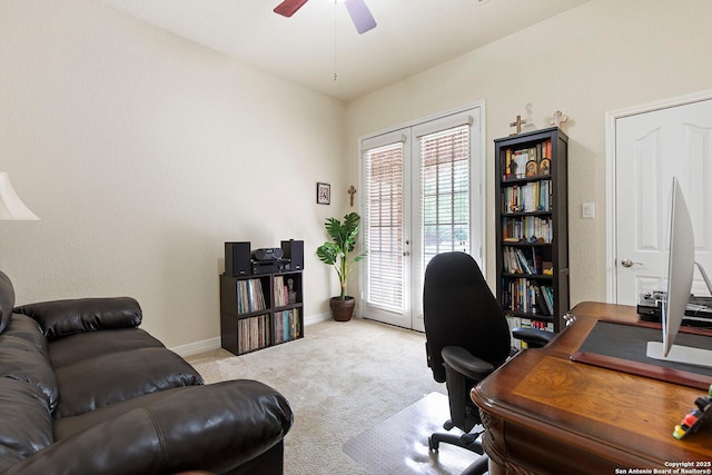home office with baseboards, light colored carpet, ceiling fan, and french doors