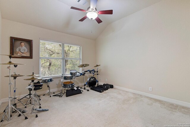 workout area featuring ceiling fan, carpet floors, baseboards, lofted ceiling, and visible vents