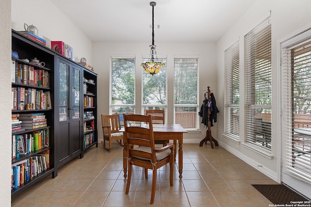 dining space with visible vents, baseboards, and light tile patterned floors