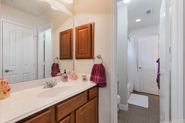 bathroom with tile patterned floors, vanity, shower / tub combo, toilet, and visible vents