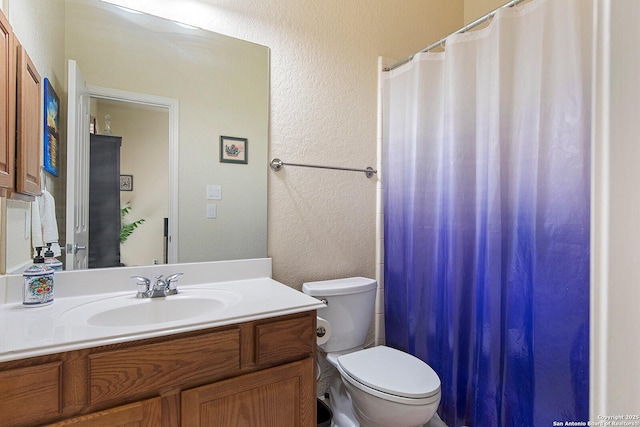 406 Penstemon, San Antonio, TX 78256 - full bath featuring toilet, a textured wall, vanity, and curtained shower
