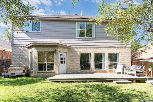 21707 Beaver Bnd, San Antonio, TX 78258 - back of property with brick siding, a lawn, a wooden deck, and fence
