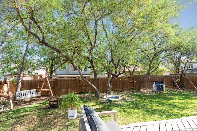 21707 Beaver Bnd, San Antonio, TX 78258 - view of yard featuring a fenced backyard and an outdoor fire pit