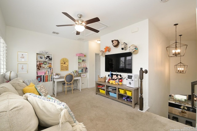 carpeted living area with ceiling fan with notable chandelier and visible vents