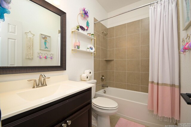 bathroom featuring toilet, vanity, and shower / bath combo with shower curtain