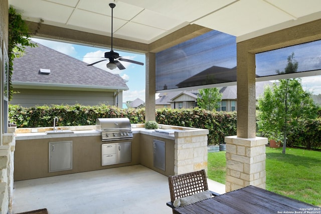 view of patio / terrace featuring a sink, ceiling fan, and area for grilling