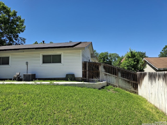 7722 Village Oaks Dr, Live Oak, TX 78233 - back of house with roof mounted solar panels and central AC