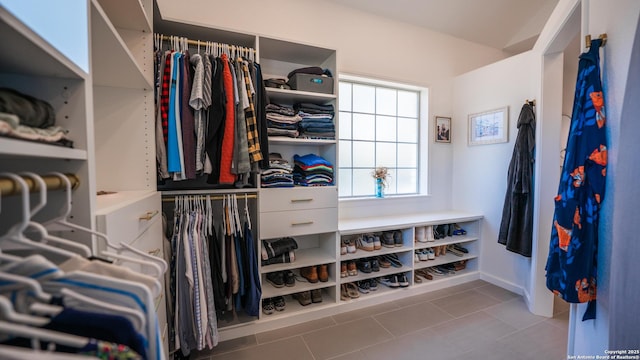 walk in closet with tile patterned flooring