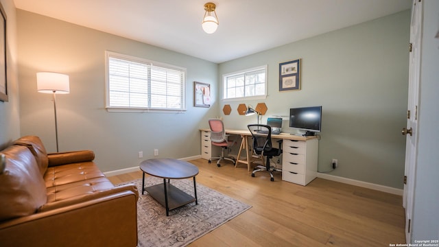 office area with wood finished floors and baseboards