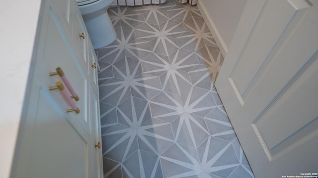 interior details with toilet and baseboards