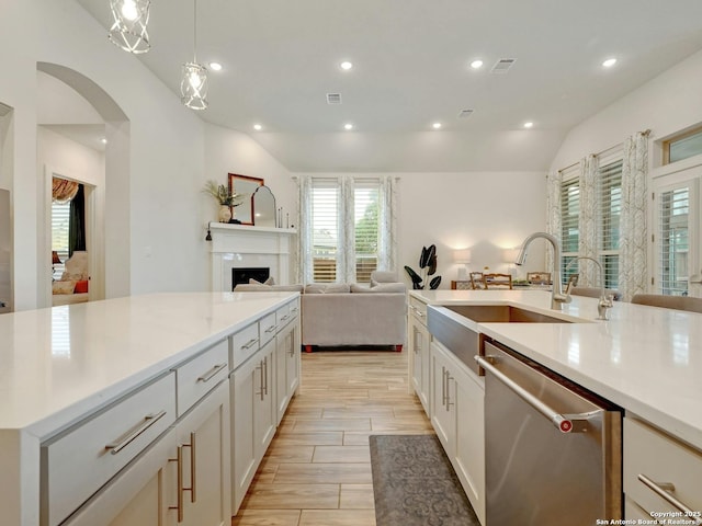 24742 Para Siempre, San Antonio, TX 78261 - kitchen featuring stainless steel dishwasher, visible vents, light countertops, a sink, and vaulted ceiling