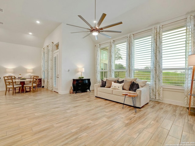 24742 Para Siempre, San Antonio, TX 78261 - living area featuring a ceiling fan, baseboards, plenty of natural light, and light wood-type flooring