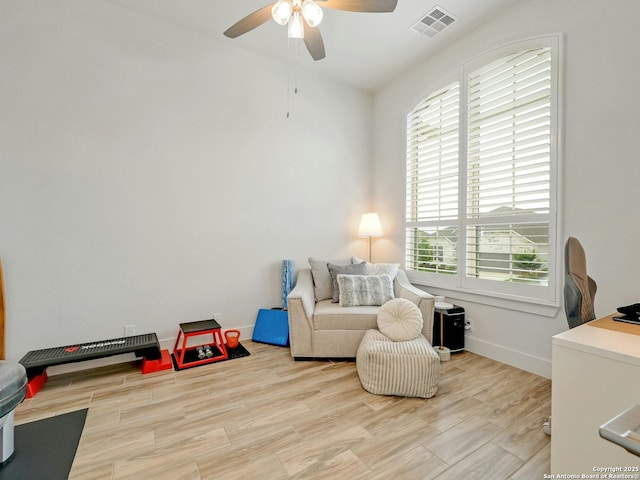 24742 Para Siempre, San Antonio, TX 78261 - living area with ceiling fan, visible vents, baseboards, and wood finished floors
