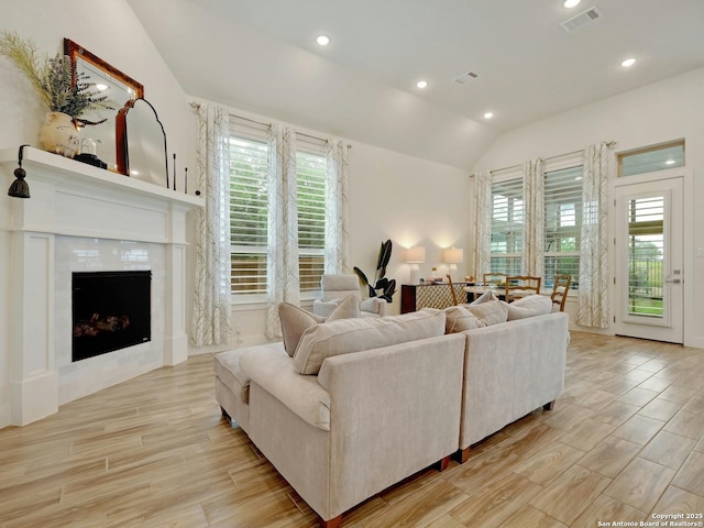 24742 Para Siempre, San Antonio, TX 78261 - living room with light wood-style floors, a wealth of natural light, vaulted ceiling, and visible vents