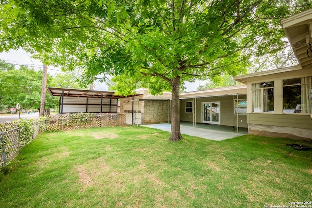 view of yard featuring fence and a patio
