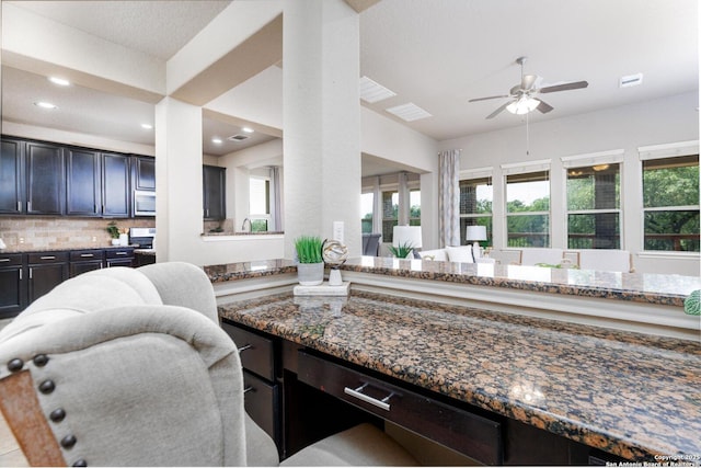 bathroom with tasteful backsplash, visible vents, recessed lighting, a ceiling fan, and vanity