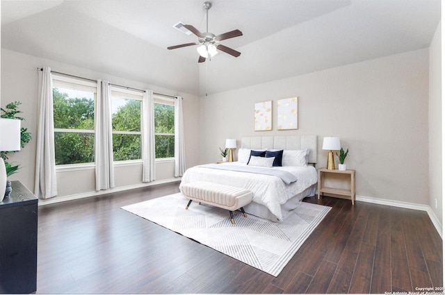 bedroom with dark wood finished floors, baseboards, visible vents, lofted ceiling, and ceiling fan