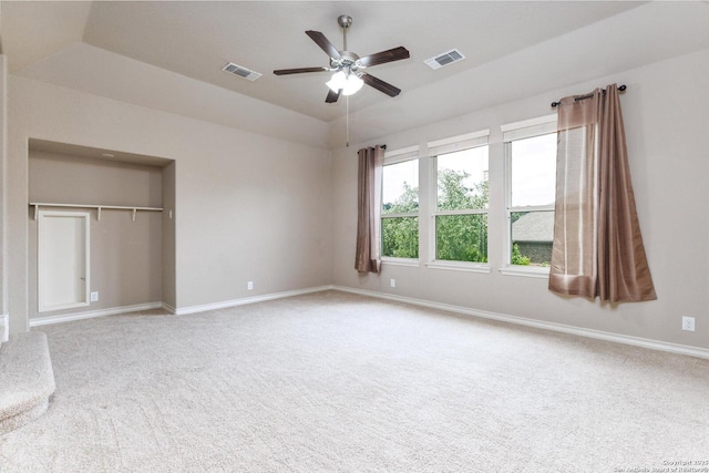 unfurnished bedroom featuring carpet floors, visible vents, and baseboards