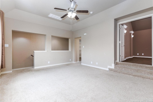 carpeted empty room featuring baseboards, a ceiling fan, and visible vents