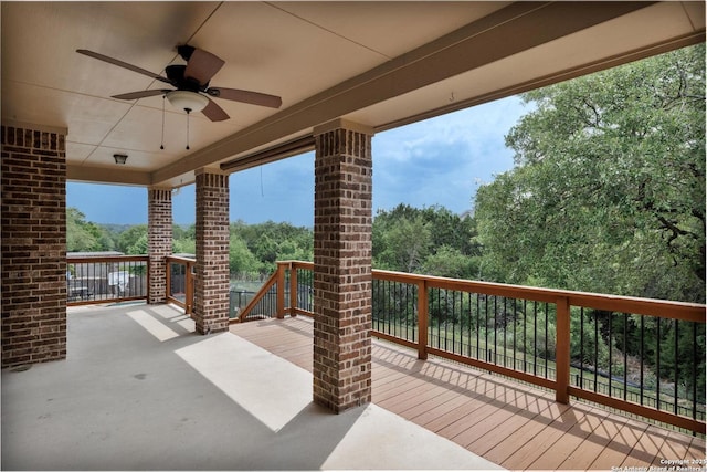 view of patio with a deck and ceiling fan