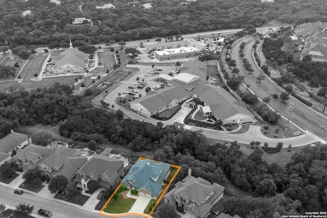 bird's eye view with a view of trees and a residential view