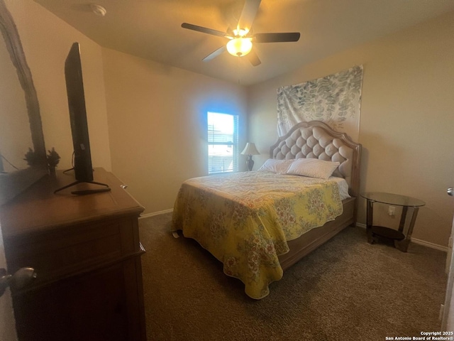 carpeted bedroom with baseboards and a ceiling fan