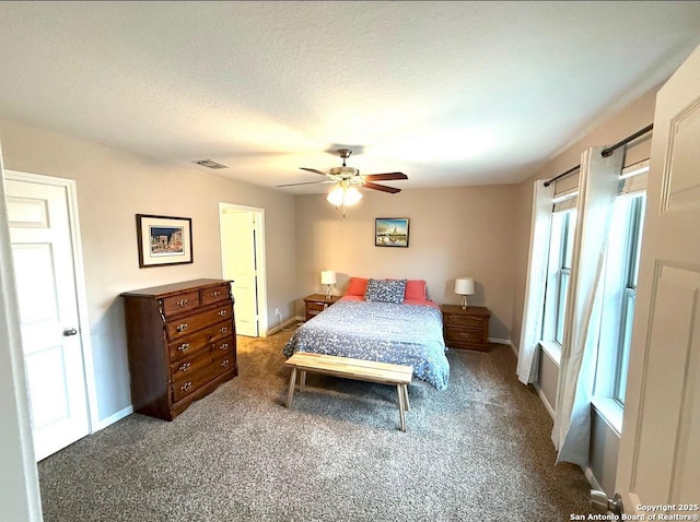 bedroom with baseboards, a ceiling fan, carpet flooring, and visible vents