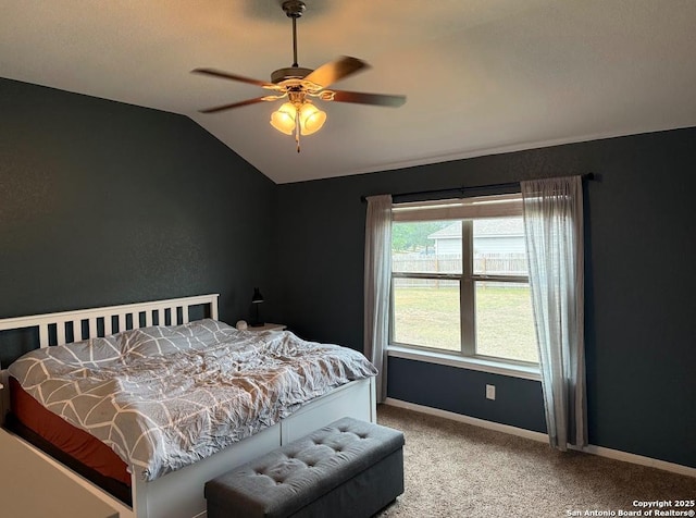 bedroom with lofted ceiling, a ceiling fan, baseboards, and carpet