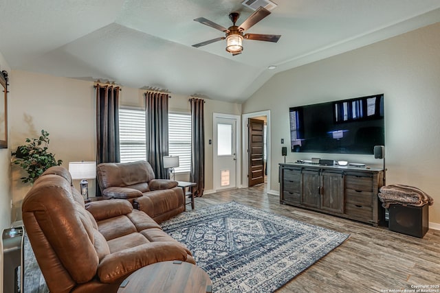 12177 Tower Frst, San Antonio, TX 78253 - living room featuring vaulted ceiling, visible vents, baseboards, light wood-style flooring, and ceiling fan