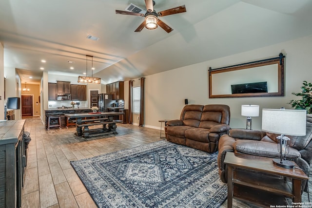 12177 Tower Frst, San Antonio, TX 78253 - living area with lofted ceiling, light wood-style flooring, visible vents, and a ceiling fan